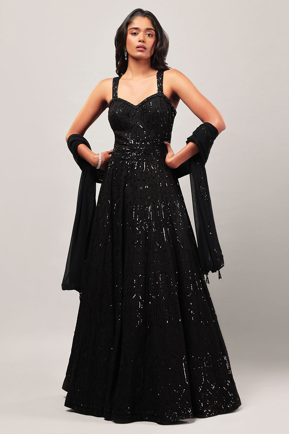 RAVEN BLACK CLASSIC GOWN SET WITH ALL OVER PATTERNED THREAD AND SEQUIN WORK AND AN EMBROIDERED NECKLINE PAIRED WITH A MATCHING DUPATTA. Seasons India