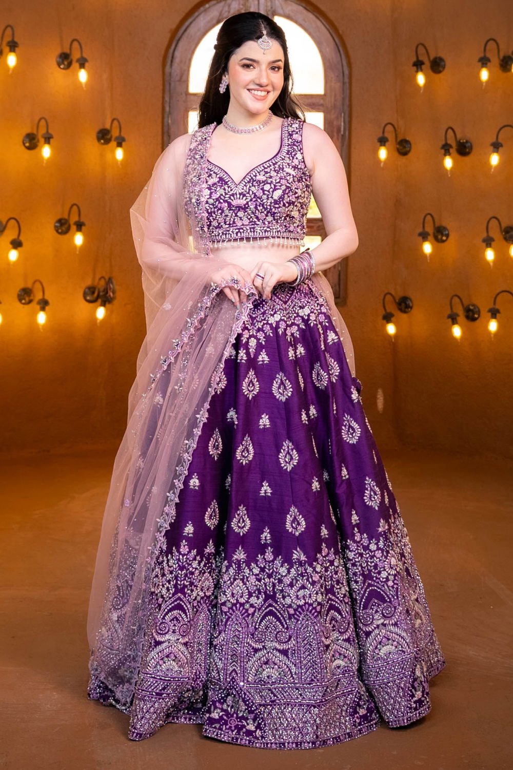 DEEP PURPLE BRIDAL LEHENGA SET WITH SELF AND COLOURED EMBROIDERY PAIRED WITH A CONTRAST DUPATTA AND ALL OVER CRYSTAL HIGHLIGHTS Seasons India